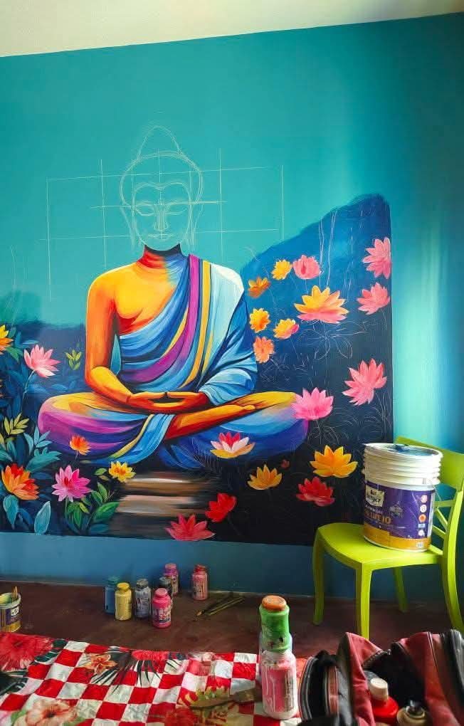 Artist painting mural